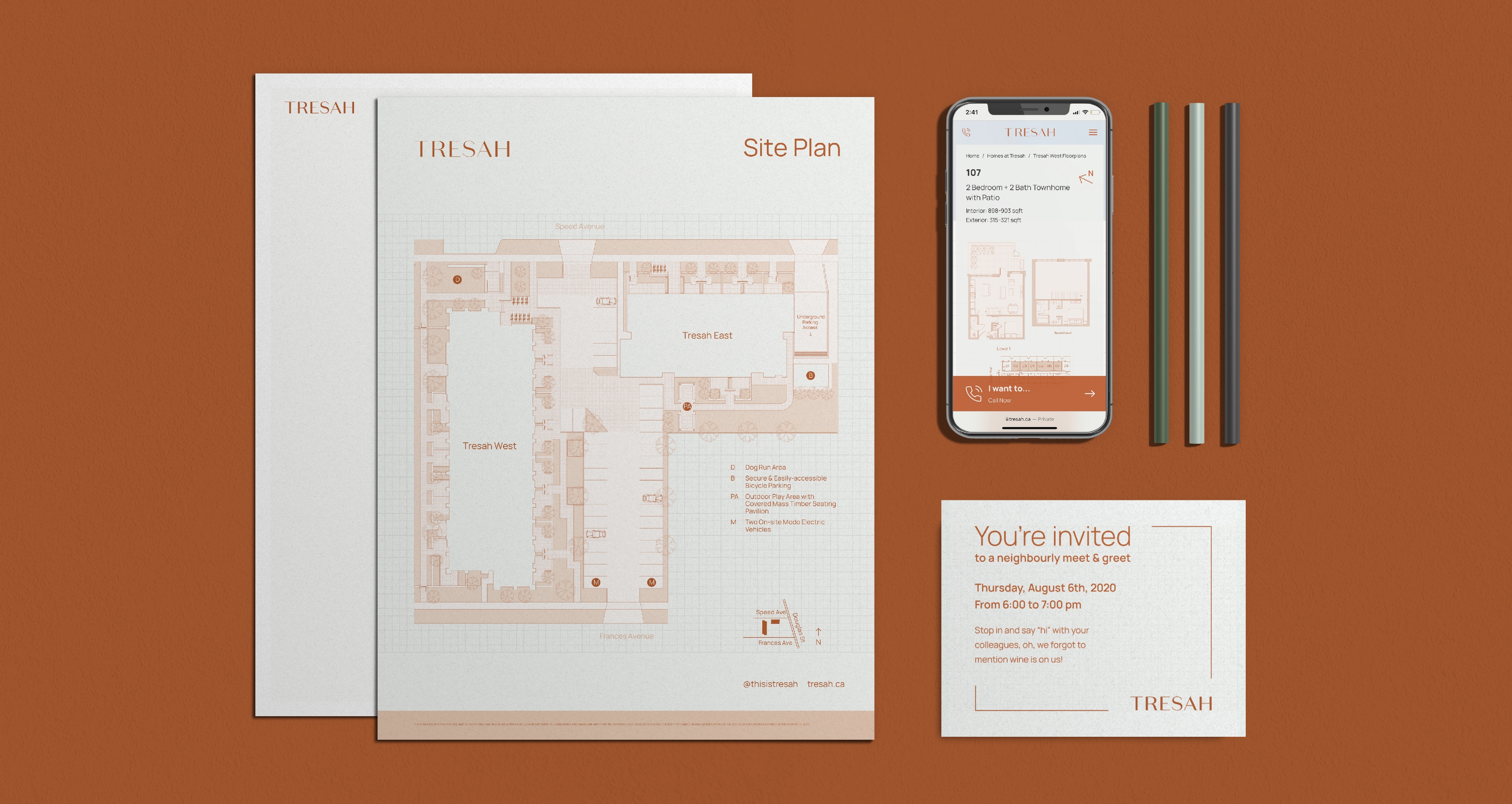 Tresah branded stationary featuring a floor plan, invitations, pens, and mobile phone with Tresah website on display.