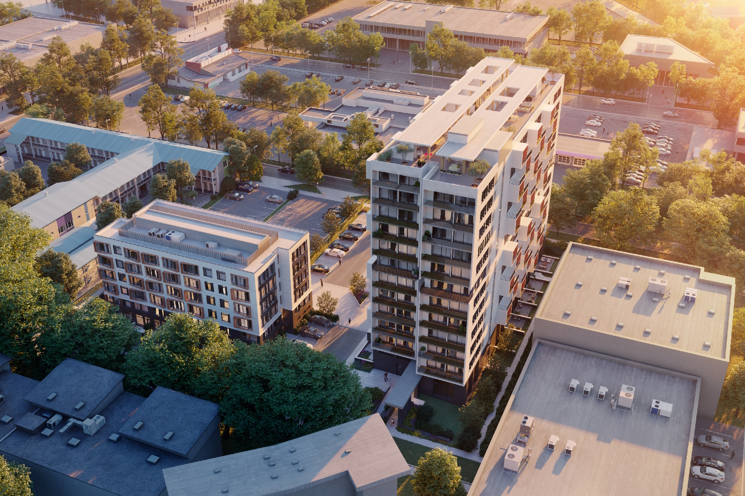High angle perspective of highrise building between multiple lowrise buildings.