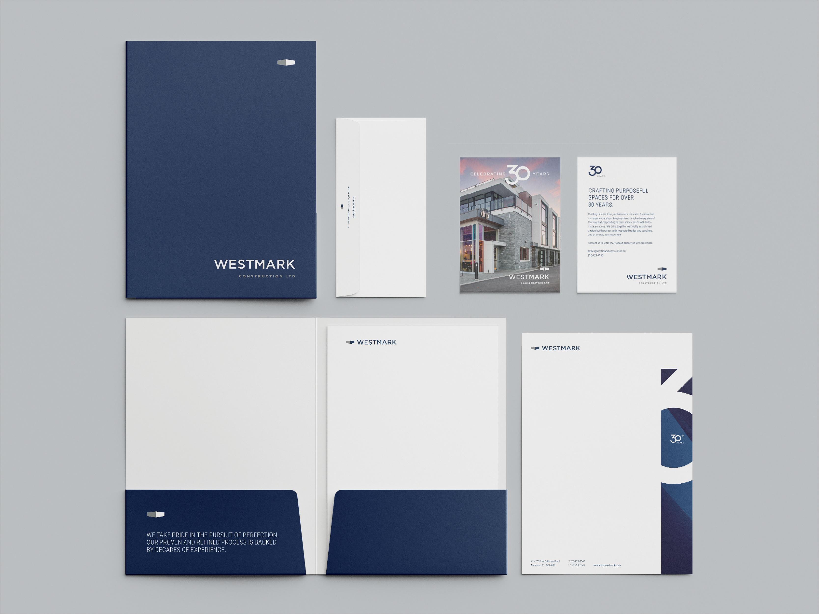A collection of sleek, minimalist office stationery with Westmark branding.