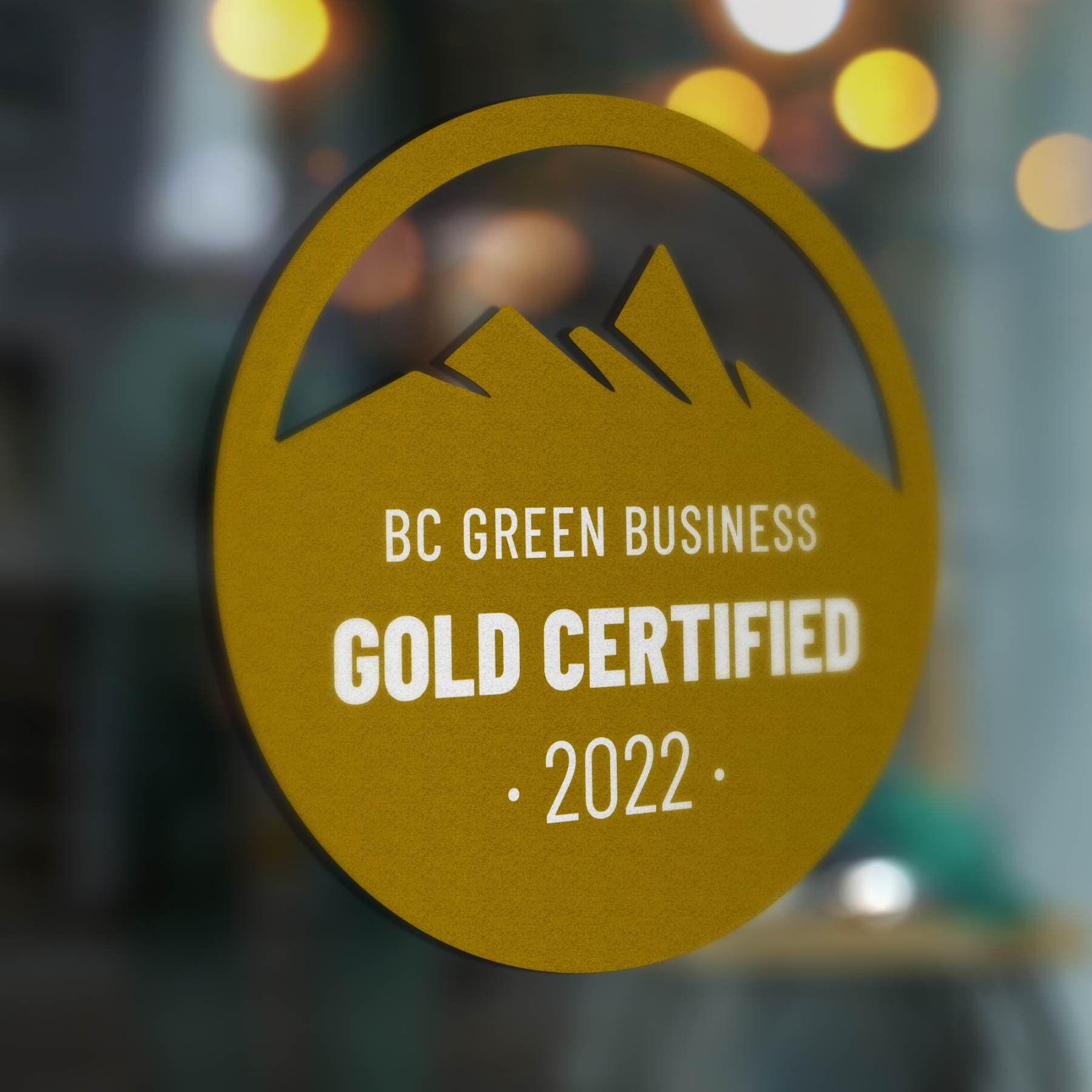 BC Green Business certification badge in Gold on a window.